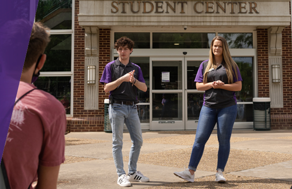 Students giving campus tour in front of Student Center
