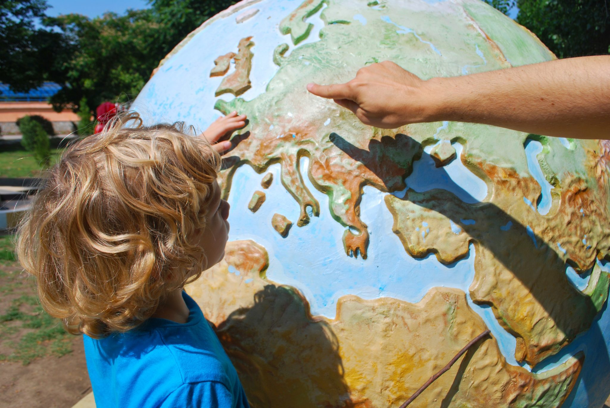 pxhere image child exploring a globe